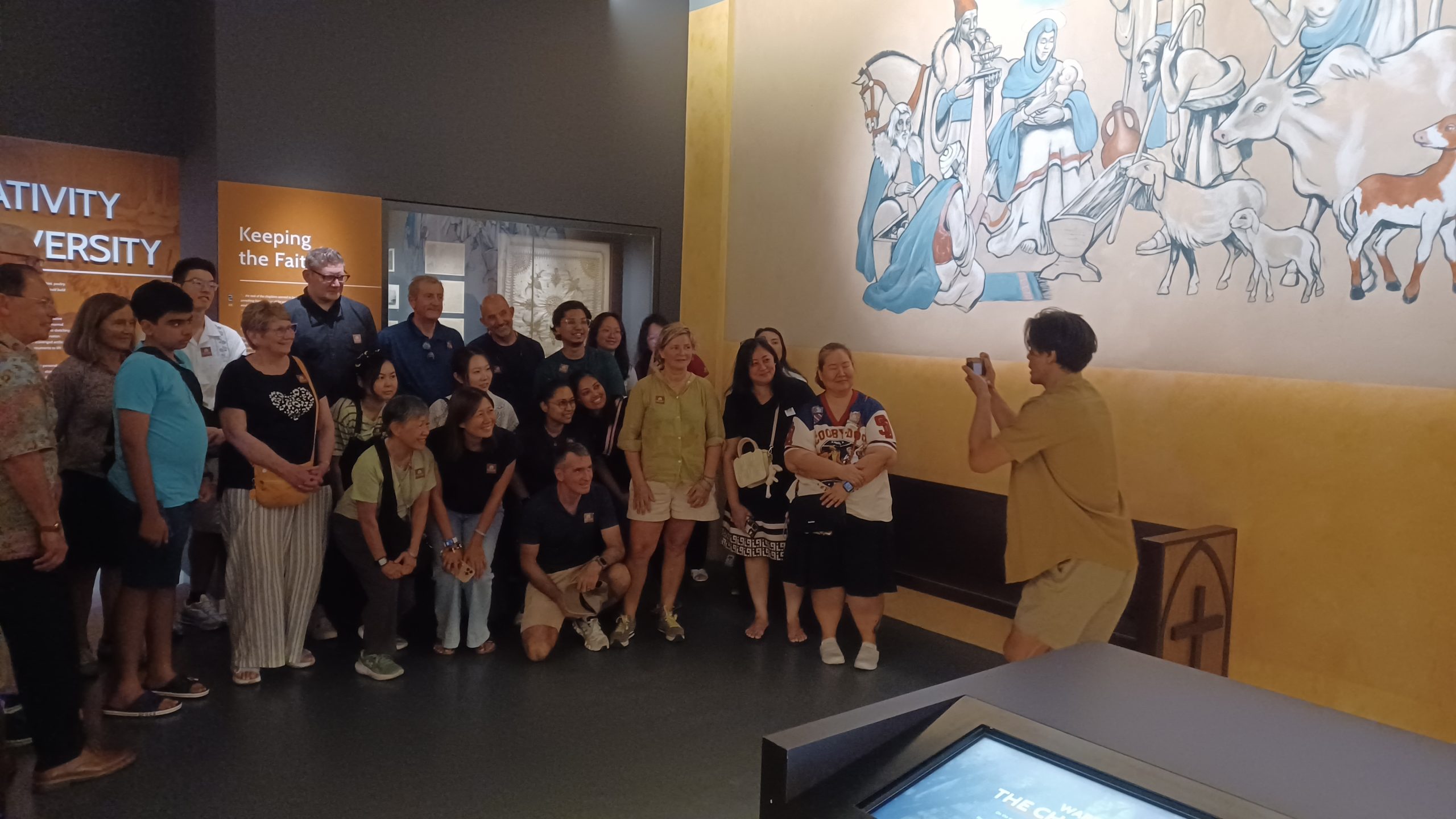 One of our lead actors, taking a group photo of the audience as part of the interactive segment of the Scene where the docent talked about contrabands like cameras etc. The actor acted out a fidgety, careful character to emphasise on keeping the contraband out of sight of the Japanese officers.