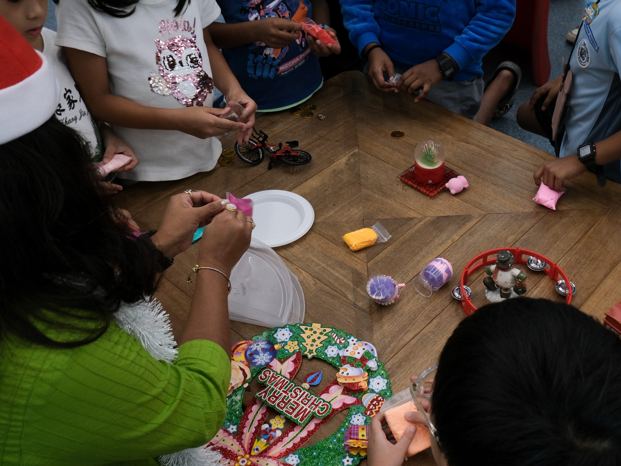 The storyteller engaging with the children during the storytelling session in the library.