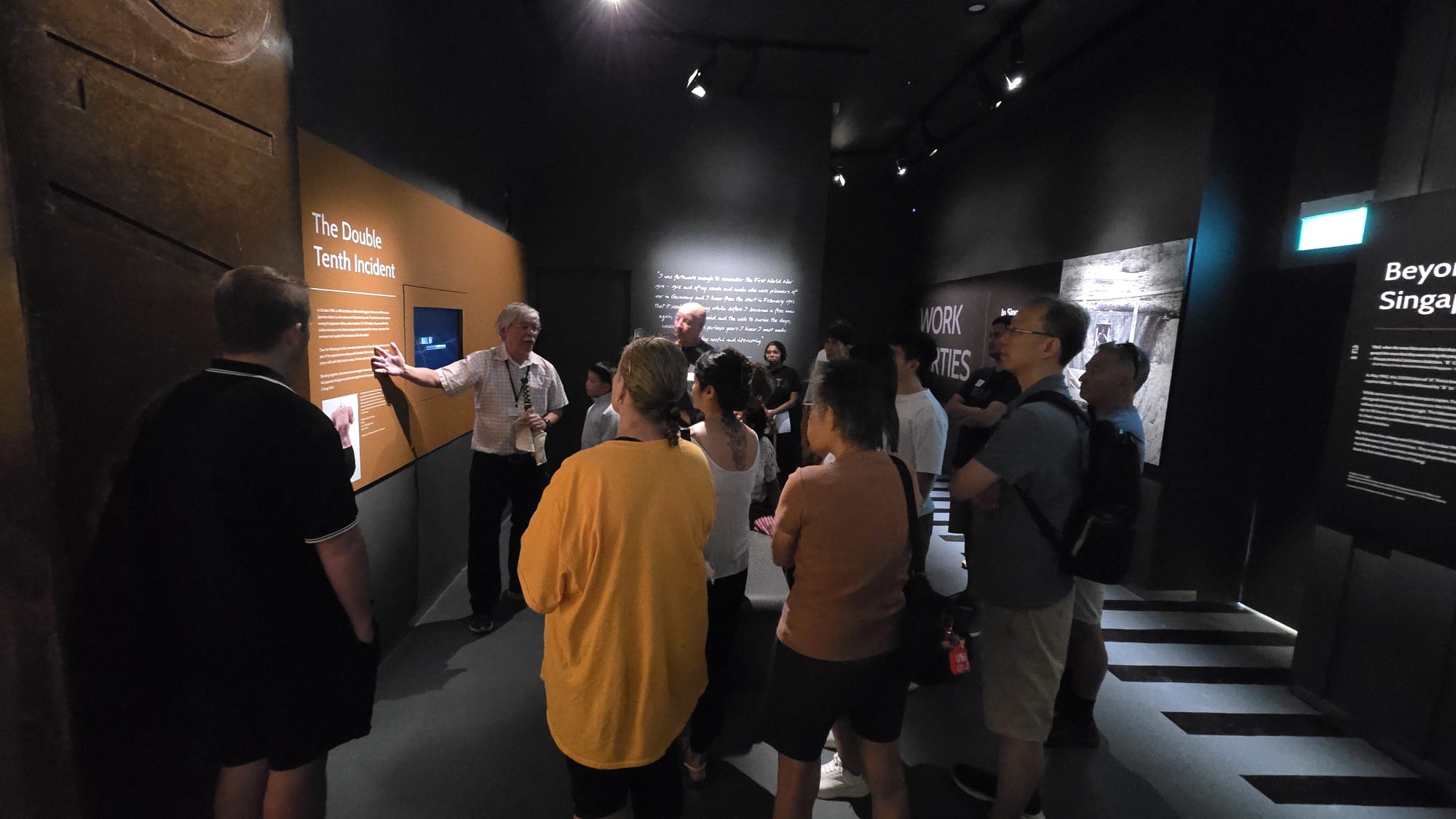 Docent explaining to the audience the history of the Double 10th Incident, and also the Death Railway, which inspired the team to do a Scene where a POW gets beaten up by a Japanese Officer. This scene also engages with the audience by roping them in using dialogues.