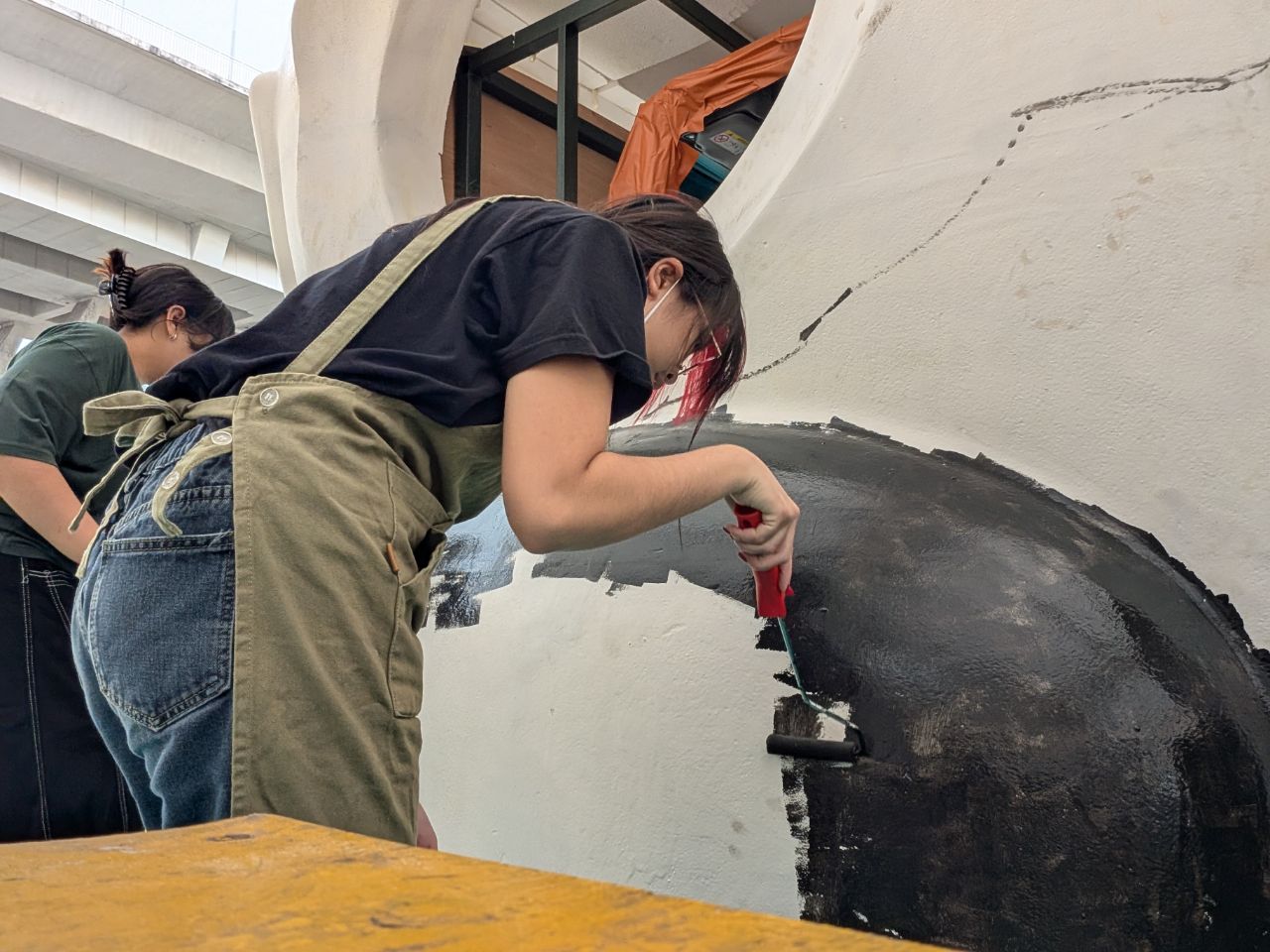 Painting and preparation of float head done by team members