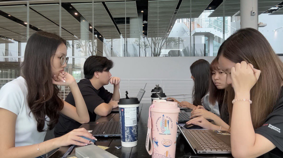 This image captures the team during one of our very first meetings, highlighting the initial planning and collaborative discussions that laid the foundation for the Symbiosis 2026 project.