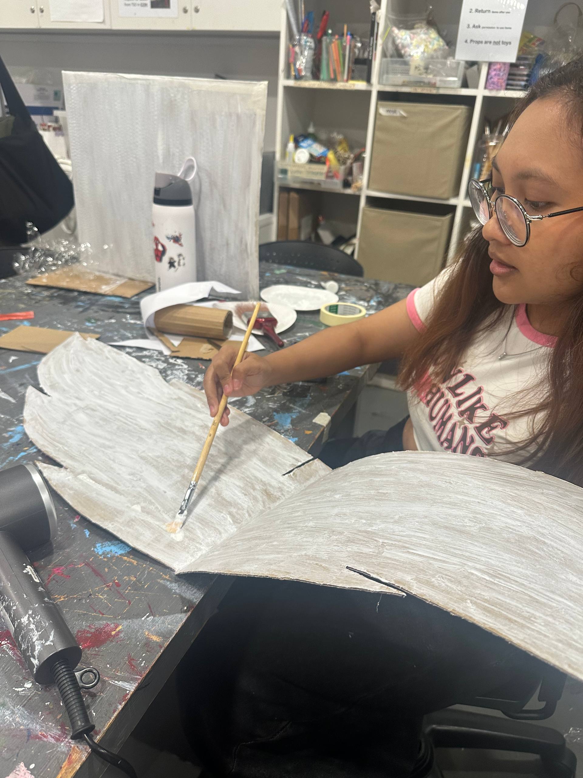 painting our cardboard tree white as the base