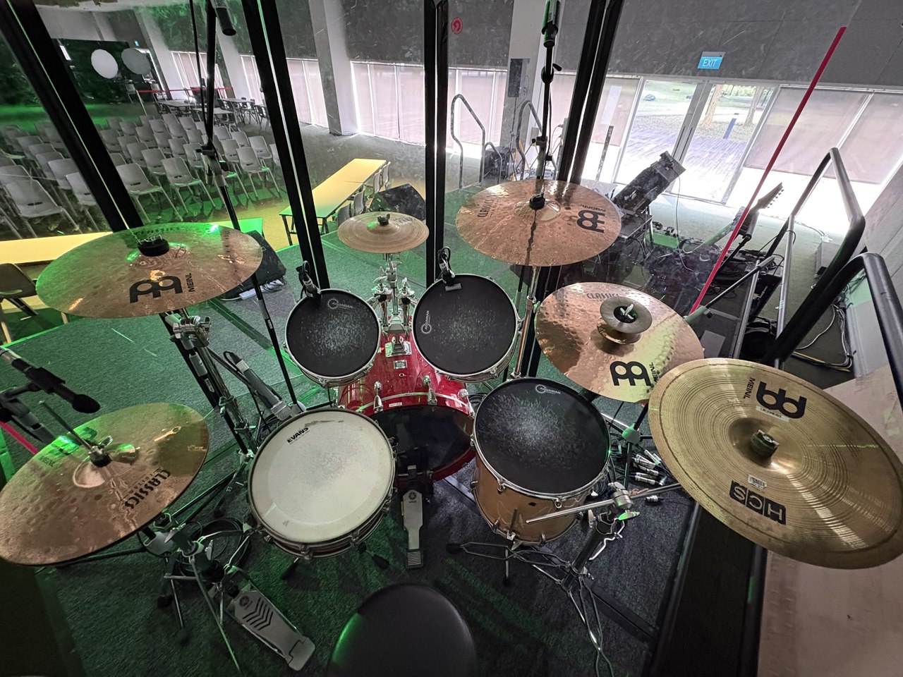 The setting up of the drums and also including a drum shield to make sure all the drum parts are placed properly and all the mics are working and produces good sound.