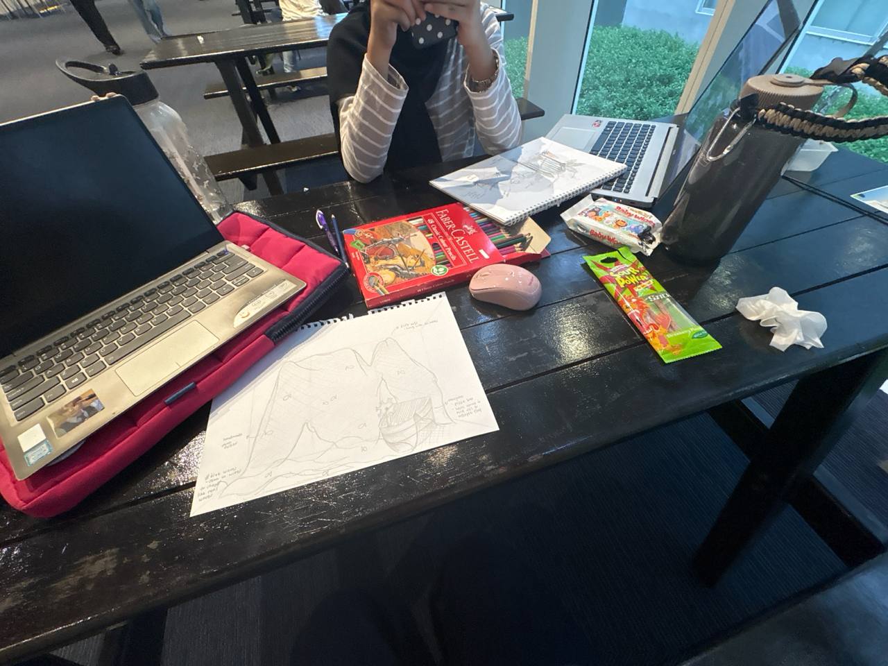 ideating process of the team sketching out set designs